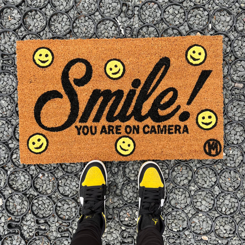 SMILE YOU ARE ON CAMERA MAT