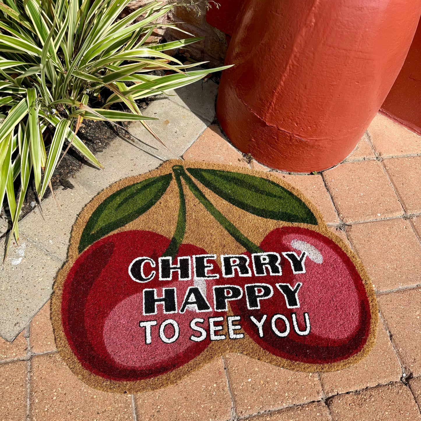 CHERRY HAPPY YOU’RE HERE MAT *LIMITED EXCLUSIVE*