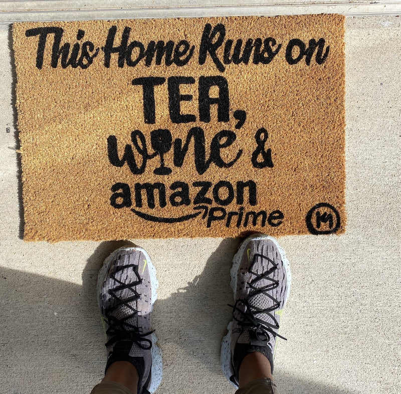 THIS HOME RUNS ON TEA WINE AND AMAZON PRIME MAT
