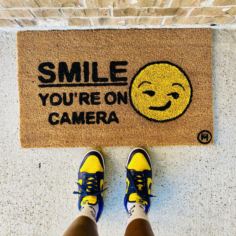 SMILE YOU’RE ON CAMERA MAT